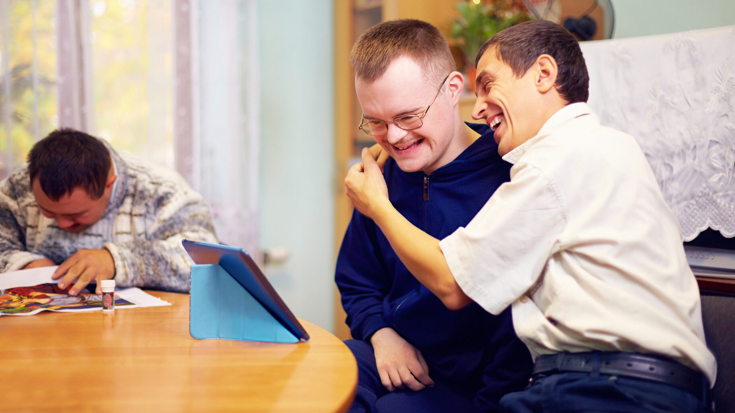 happy friends with disability socializing through internet