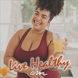 A healthy woman smiling with fresh fruit juice