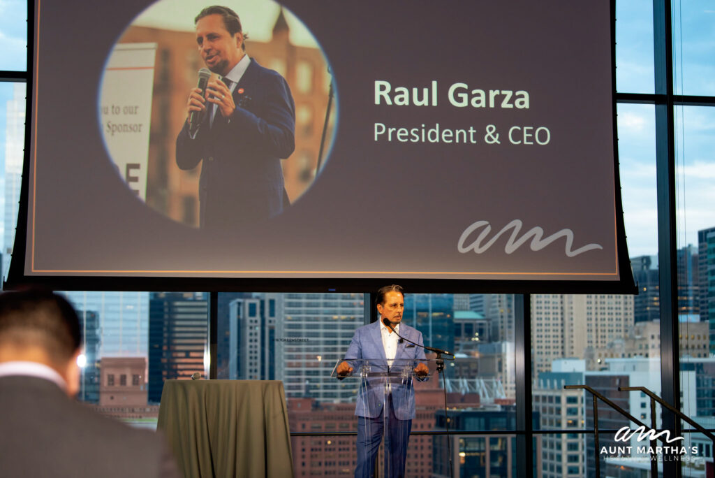 Addressing attendees at Aunt Martha's gala event, Raul Garza honors key donors for their contributions, allowing the nonprofit to provide healthcare to over 50,000 patients annually in vulnerable communities.